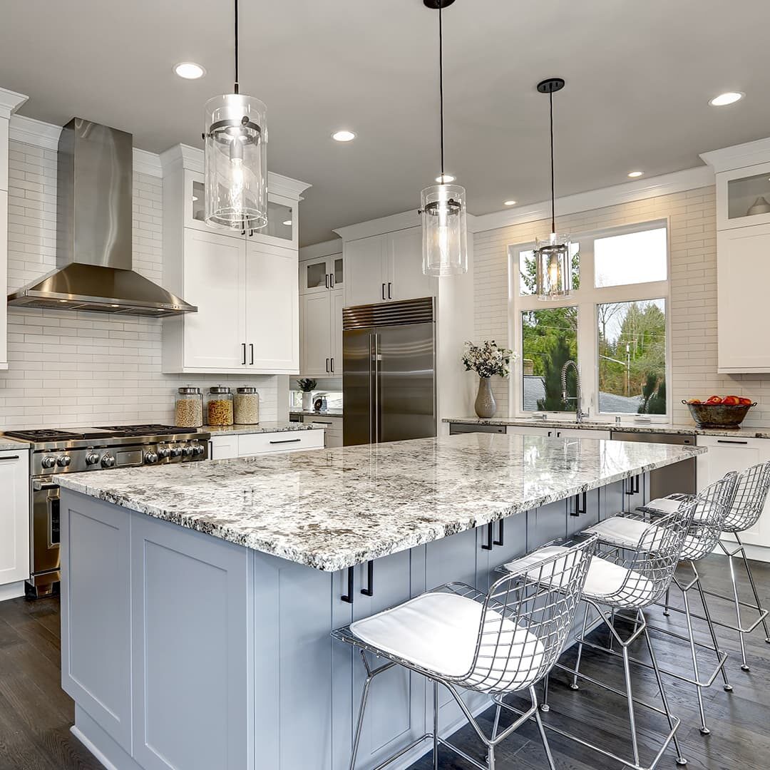 Pretty, white open kitchen and living room